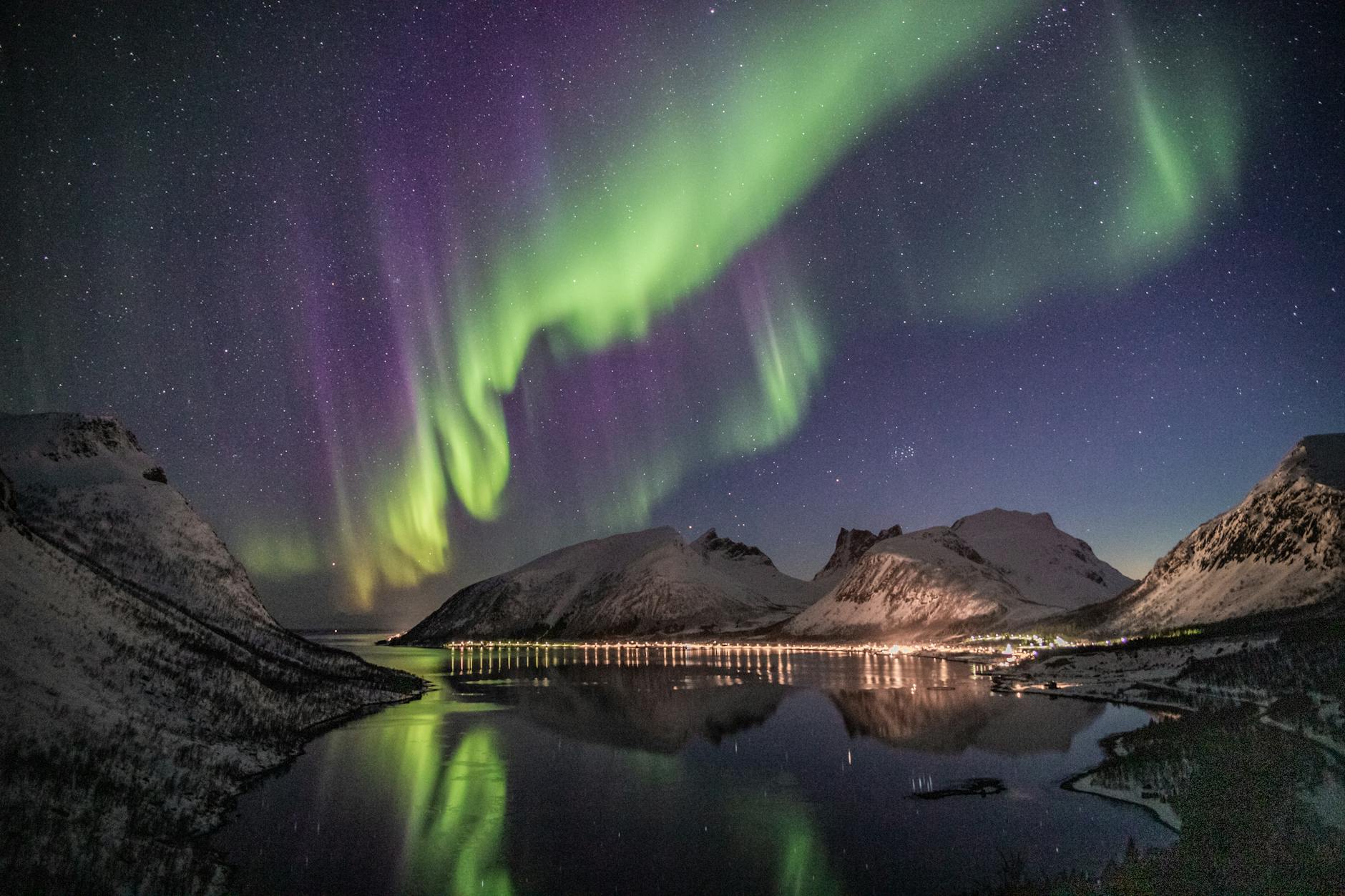 Aurora borealis dancing over Norwegian mountains